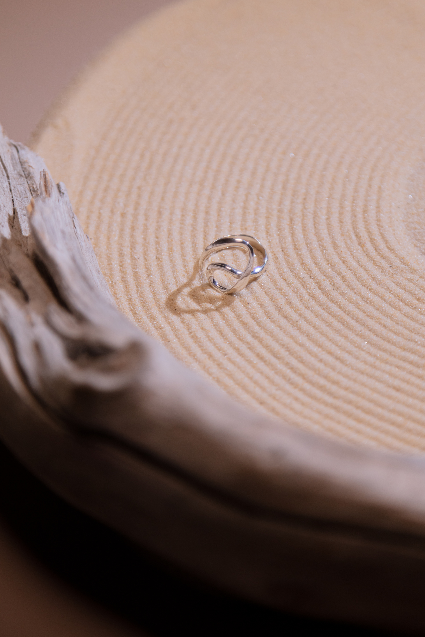 Silver Ring on Brown Wooden Surface